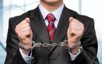 Businessman in handcuffs